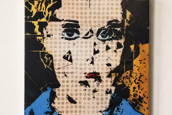 Tableau de l'artiste Paul Wal à Genève représentant un visage de femme réalisé avec des pochoirs et des bombonnes de spray de peinture.